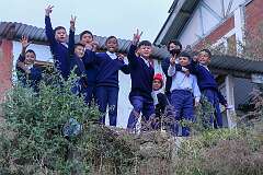 A happy group of school boys along the road in Bomdila.