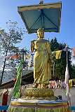 A Buddha statue in a blessing position, at the junction of the road to the Upper Monastery with the Charifduar-Tawang Road, Bomdila.