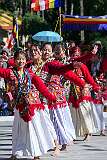 Young women perform a group dance.