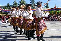Students perform a Tibetan group dance, depicting agriculture.