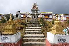 The 108 Buddhist Stupas, known as Manes, in Mandala Top, arranged in concentric circles around a golden Buddh statue, at 3214 metres altitude and 27 kilometres south of Dirang.