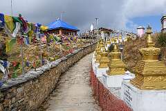 Going around the 108 Buddhist Stupas of Mandala Top, displaying the names of each sponsor. Each stupa was contributed towards by every single family, making this religious site a testament to the strong communal bonds among the people.
