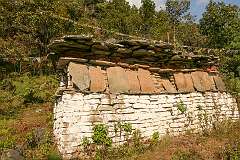 A wall with mani stones, sacred inscriptions, just west of Thembang Heritage Village.