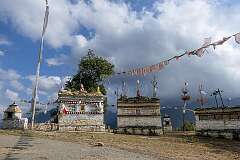 Commemorative walls with mani stones, sacred inscriptions, west of Thembang.