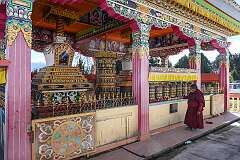 Prayer wheels and chorten in a shrine at Tawang Monastery.