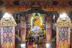 The Dukhang, the main assembly hall in Tawang Monastery, with its large Buddha statue, as seen from the upper floor.