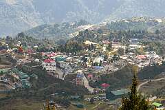 View over Tawang, with its huge Buddha statue, from the road leading north, at 10 kilometres by road from the town
