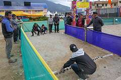 Men playing “Lei”, a traditional game, at the Tawang Festival showground.