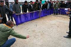 Men playing “Lei”, a traditional game, at the Tawang Festival.