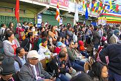 Watching the Carnival Parade on the first day of the Tawang Festival.