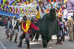 Dancing “yaks” with masked dancer in the Carnival Parade on the first day of the Tawang Festival.