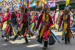 Women dancers with headdresses in the Carnival Parade on the first day of the Tawang Festival.
