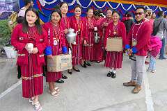 Women in traditional Monpa dress posing after the Carnival Parade on the first day of the Tawang Festival.