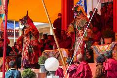 Masked dancers walk from the main hall of the Monastery to the dancing ground.