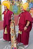 Monks with ceremonial headdresses and face paint to keep order with long staves, for the Torma ritual at the Drub-chod-Chen-Mo Cum Bomdila Torgya.