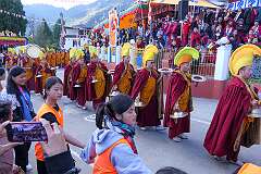Monks with ceremonial headdresses leading the procession with the “Torma”, spiritual cake, carrying pairs of Cymbals (“Bub”) and Ritual Drum (“Choe-Nga”) at the Drub-chod-Chen-Mo Cum Bomdila Torgya.