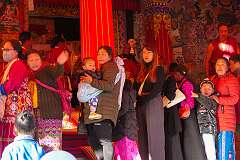 Women waiting to go inside the Upper Gompa of the Gontse Gaden Rabgyel Ling Monastery for the “initiation of the White Tara” ritual.