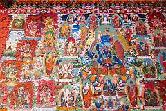 Wall painting at Khinmey Nyingma Monastery, founded in 1440. The main prayer hall is covered with fantastic, brightly coloured murals of hundreds of deities.