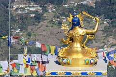 Buddhist statue and prayer flags along the Chariduar-Tawang road, near the village of Jang, at 3,210 metres altitude.