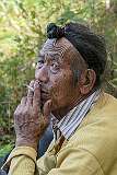Millo Nyime smoking a cigarette after the Danyi Piilo (Donyi Polo) ritual he performed.