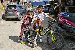 Two Apatani boys with their bike in Tajang.