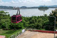 The Guwahati Passenger Ropeway, from North Guwahati with Guwahati across River Brahmaputra; with Peacock Island midway.