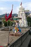 Ganesha statue and temple gopuram seen from the Zoo Road flyover in Guwahati.