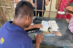 Checking passport at the entrance of Talatal Ghar, a palace of the Ahom kings.