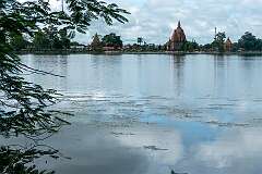 The view across Sivasagar tank to Siva Dol, Vishnu Dol, and Devi Dol, temples built by Bar Raja Ambika, queen of Ahom king Swargadeo Siva Singha (1714–1744).
