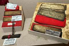 A book in the Tai language on Sanchi leaves and on paper, with the Astrological bamboo stick book in the Assam Tai Museum.