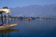 View of Dal Lake with houseboats and “shikara” water-taxis.