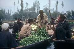 Vegetable trade in the floating market.