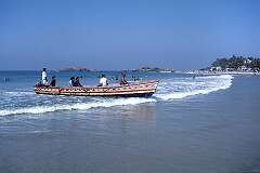 A fishing canoe arriving on the beach of Kovalam, 17 kilometres south of Thiruvananthapuram.
