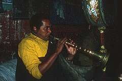 A monk playing the “kangling” at Alchi monastery.