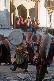 Monks, beating “Dhyangro” drums and cymbals march around the monastery.