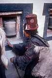 Ladakhi woman turning a prayer wheel (“khor lo”) in Hemis Gompa;.