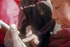 A young novice trying out a pocket calculator.