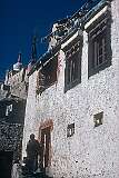 A house below Leh Palace and a chorten (pagoda) above.