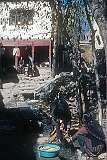 Women doing the laundry in a street in Leh.