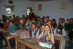 In the classroom, with their teacher, Girls' High School.