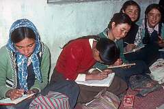 Students writing in class during a lesson in the Girls' High School.