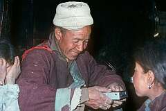 Tashin Nurubu with a small Sony tape recorder at his family's home in Leh.