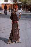 A man with a prayer wheel (mani-chos-'khor) in the bazaar of Leh.