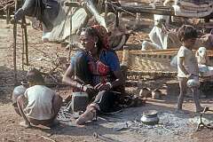 Awoman and children in the nomad encampment, Khajuraho.