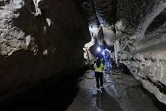 Tourists inside the Arwah-Lumshynna Cave, in the East Khasi Hills District, near Cherrapunji.