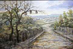 A painting of a road leading into a Mizo village in the time they practised headhunting; in the Mizoram State Museum on MacDonald Hill.