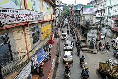 View of Bara Bazar, in Dawrpui, Aizawl. The sign in Mizo reads: “YMA is a helper of the needy”.