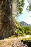 Overhanging rock face with a small waterfall about 3 kilometres along the road south of Reiek.