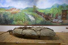 A Naga monolith and representation how it was transported to a village; at the Nagaland State Museum, Kohima.