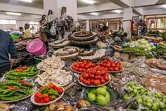 Chillies, tomatoes and honeycombs for sale in the T-Khel Daily Market.
